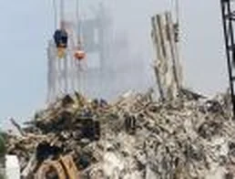 Rescue and recovery workers on the debris pile at Ground Zero in 2001