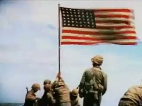 U.S. Marines raise the American flag on Iwo Jima in 1945, a still from Sgt. Bill Genaust’s color film